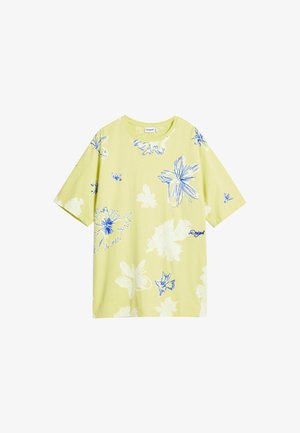 Maglietta oversized gialla chiaro con motivo floreale blu. Maniche corte, scollatura rotonda, il davanti presenta un piccolo logo. Tessuto morbido.