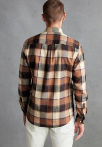 Next CHECK - Vapaa-ajan kauluspaita - rust orange