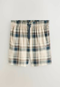 Plaid lounge-shorts i beige, marineblå og grønne nuancer. Fremstillet af blødt stof med elastisk taljebånd og justerbar snøre. Har sidelommer.