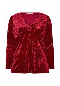 Czerwony aksamitny top z głębokim dekoltem w serek, długimi rękawami i marszczeniem w okolicy biustu. Gładka tekstura z połyskującym wykończeniem.
