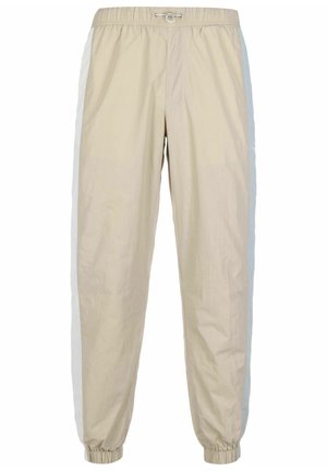 Pantalones jogger beige ligeros con cintura elástica, cordón ajustable, bolsillos laterales y puños elásticos en los tobillos.