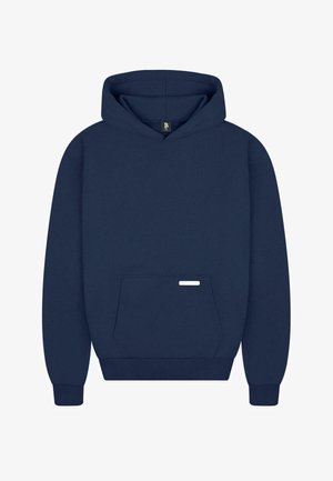 Navy blue hooded sweatshirt made of soft fabric, featuring a front pocket and a small white branding label. Classic design with cuffs.