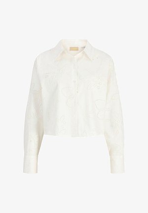 Cămașă scurtă albă cu mâneci lungi, nasturi pe față, guler ascuțit și model floral brodat cu perforații pe toată suprafața.