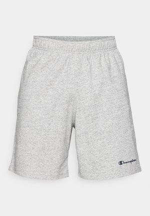 Shorts en jersey gris avec une taille élastique et un logo "Champion" bleu marine en bas à gauche.