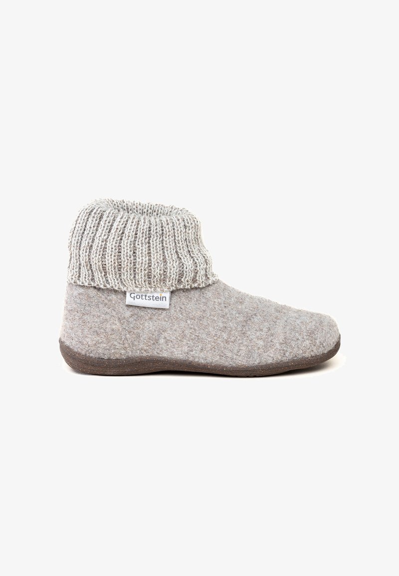 Gray wool slipper with a knitted gray cuff and dark brown sole. Features a label on the side with the brand name "Gottstein."