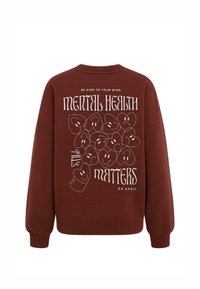 Felpa bordo con collo a giro. Presenta testo bianco e grafiche di facce sorridenti sul retro. Tessuto morbido, polsini e fondo a costine.