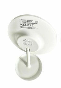 Miroir StylPro Melody ; base en plastique blanc, surface de miroir arrondie, mât central, trous pour haut-parleur, étiquettes pour la batterie et l'entrée USB à l'arrière.