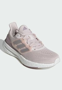 Light pink running shoe with a breathable mesh upper, three-stripe design in a translucent accent, and a textured white sole.