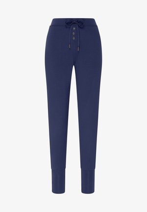 Granatowe spodnie dresowe wykonane z miękkiego materiału, z elastycznym paskiem w pasie, z guzikami z przodu oraz dopasowanymi mankietami przy kostkach.