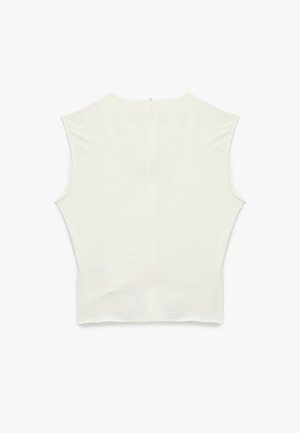 Haut sans manches blanc au design ajusté, décolleté rond, fermeture éclair exposée à l'arrière et en tissu doux et texturé.