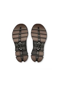 Black athletic shoe soles with rubber grip patterns, featuring a brown accent, flexible design, and a central support element.