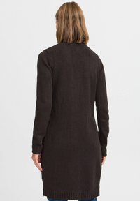 Long, dark brown cardigan made from textured knit fabric. Features ribbed cuffs and hem. No visible fasteners or patterns.