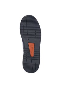 Schuhsohle mit einem strukturierten schwarzen Gummi-Design, das einen zentralen orangefarbenen Akzent und tiefe Rillen für Traktion aufweist.