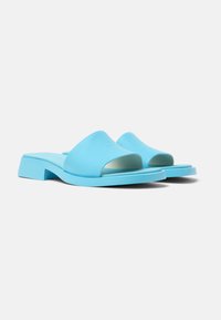 Sandali slide blu modellati con design open toe, dotati di suola piatta e tacco a blocco, realizzati in materiale sintetico liscio.