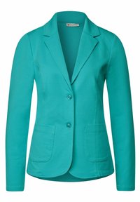 Veste turquoise avec un col structuré, deux poches avant et deux boutons. Fabriquée en tissu lisse, avec une coupe ajustée.