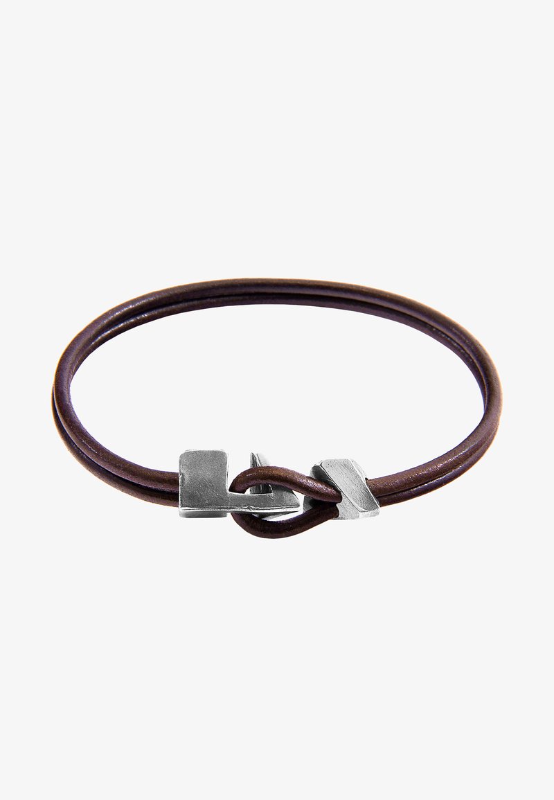 Brown leather bracelet featuring a double loop design with a silver metal clasp. The clasp has a geometric shape and textured surface.