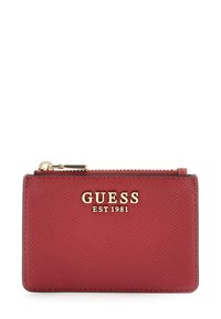 Red textured leather Guess cardholder with gold logo and zipper on top.