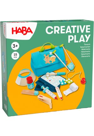 Veterinary playset in a teal bag, featuring various plastic and wooden medical tools, with colorful accents, ideal for imaginative play.
