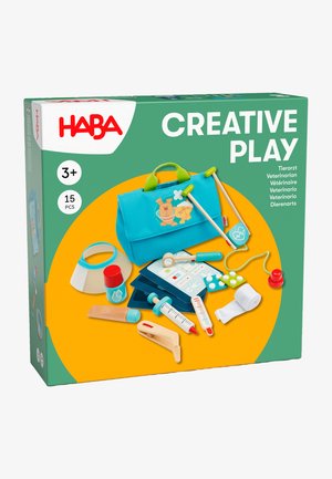 Veterinary playset in a teal bag, featuring various plastic and wooden medical tools, with colorful accents, ideal for imaginative play.