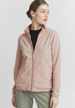 Light pink fleece jacket with a high collar, full zipper, and side pockets. Features a soft texture and long sleeves.
