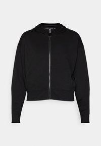 Μαύρη ζακέτα με φερμουάρ, κατασκευασμένη από απαλό, λείο υλικό. Διαθέτει κουκούλα, κοντό μήκος και ριχτές μανσέτες. Ελάχιστος σχεδιασμός χωρίς σχέδια.