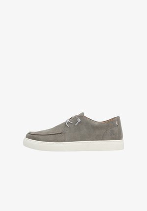 Gray suede shoe with a rounded toe, white rubber sole, and light gray laces. Features subtle stitching and a small logo on the heel.