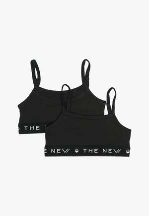 Zwarte katoen bralettes met verstelbare bandjes en een merk-elastische onderband met witte tekst, zachte textuur en een minimalistisch ontwerp.