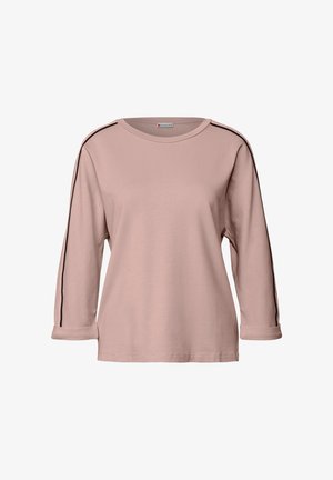 Světle růžová dlouhá rukávová košile z měkké tkaniny, s černými bočními pruhy, kulatým výstřihem a ohrnutými rukávy.