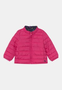 Pink puffer jacket with a zip front, featuring a navy polka dot lining, long sleeves, and quilted texture. Compact design for warmth.