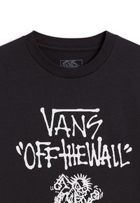 Zwart katoen t-shirt met een gedurfde witte grafische print van "VANS" en "OFF THE WALL" met daaronder een cartoonfiguur ontwerp.