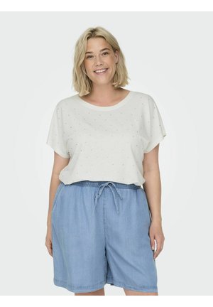 Ljust färgad kortärmad topp med avslappnad passform och subtil prickmönster, i kombination med löst sittande denimshorts med elastisk midja.