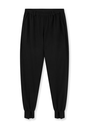 Pantalon noir fuselé avec taille élastique, poches latérales et chevilles retroussées avec fentes à l'avant.