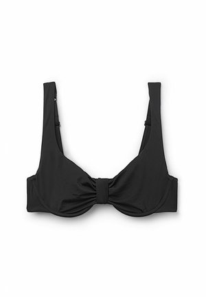 Top de bikini negro con tirantes anchos, detalle de nudo en el centro y una tela lisa y texturizada. Diseño simple y estructurado.