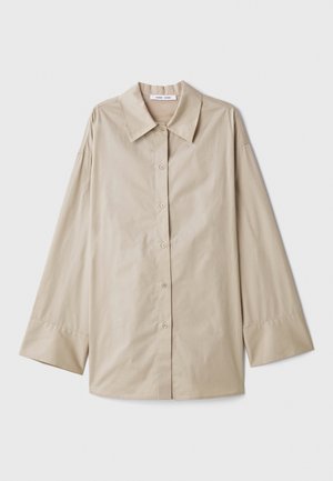 Beige long-sleeve shirt with a large pointed collar, button front, and wide sleeve cuffs. Made from a smooth, lightweight fabric.