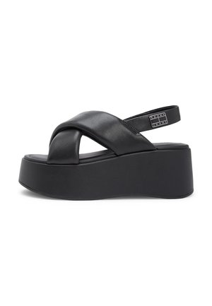 Sandalo con zeppa nero con cinturini incrociati in pelle e cinturino alla caviglia con il logo "Tommy Jeans" sul cinturino.