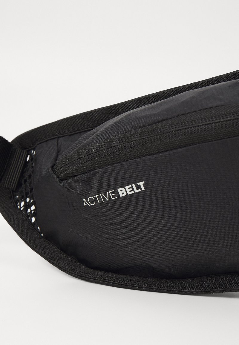 Black active belt featuring a smooth, textured surface, zippered pocket, and mesh accents. "ACTIVE BELT" logo displayed prominently.