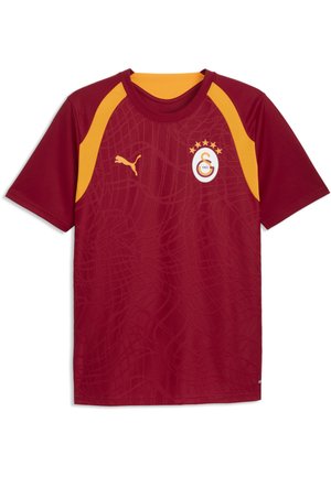 Bordowa i żółta koszulka sportowa z krótkim rękawem, z logo Puma na prawym boku klatki piersiowej i herbem klubu piłkarskiego Galatasaray po lewej stronie klatki piersiowej.