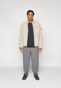 adidas Terrex NATIONAL GEOGRAPHIC JACKET UNISEX - Flísová bunda - alumina