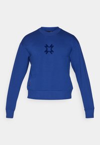 Felpa blu con girocollo, maniche lunghe e fondo aderente. Presenta un logo in un delicato blu scuro sul davanti.