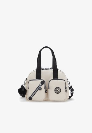 Beige nylon handbag with black accents, dual top handles, a detachable shoulder strap, and two front zippered pockets. Features branded logo.