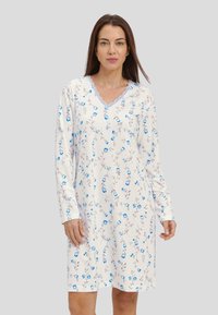 Camisón de manga larga en crema claro con patrón floral azul, escote en V y acentos de encaje. Tejido suave con un corte relajado.