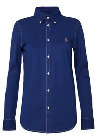 Navy blue long-sleeve button-up shirt with white stitching, button-down collar, and small embroidered logo on the chest.