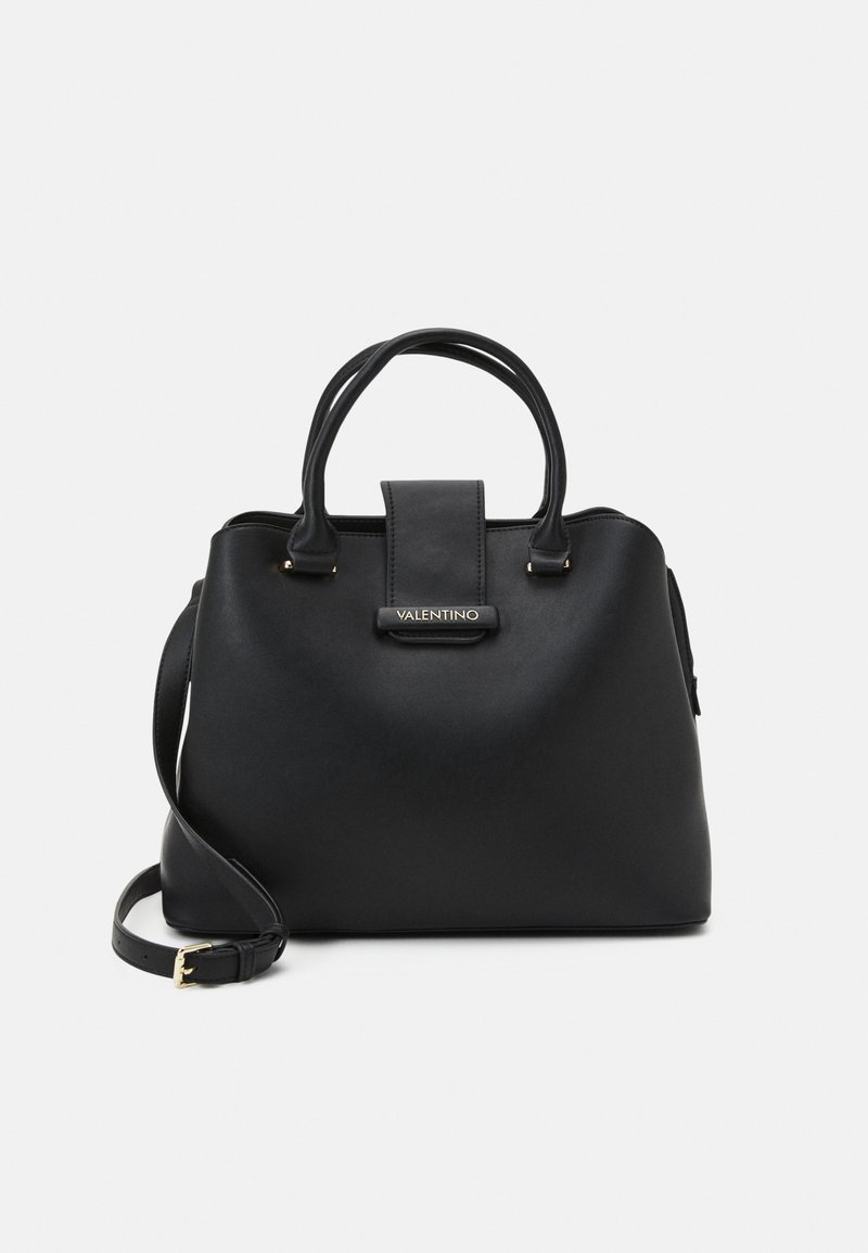 Black leather handbag with two top handles and a detachable shoulder strap. Features a central strap detail and a gold-tone logo accent.