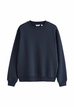 Hanorac bleumarin cu guler rotund, cu manșete și tiv ribbrate. Fabricat dintr-un material neted, cu o croială ușor lejeră și fără logo-uri vizibile.