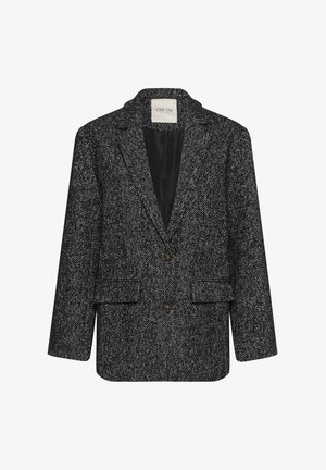 Herringbone-patterned black and white blazer with long sleeves, two front pockets, and three buttons. Lined interior, classic lapel design.