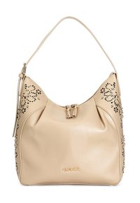 Beige leren handtas met uitsnijdingen in een bloemmotief aan de zijkanten, een enkele schouderriem en een beveiligde bovenklep met decoratieve franjes.