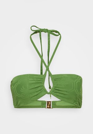 Green bikini top with textured fabric, features a central cut-out, and adjustable straps. Gold hardware at the back adds detail.
