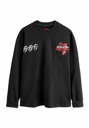 Schwarzes Langarm-T-Shirt mit drei weißen rollenden Lippen-Graphics und rotem Text auf der linken Brust, aus weichem Baumwollmaterial gefertigt.