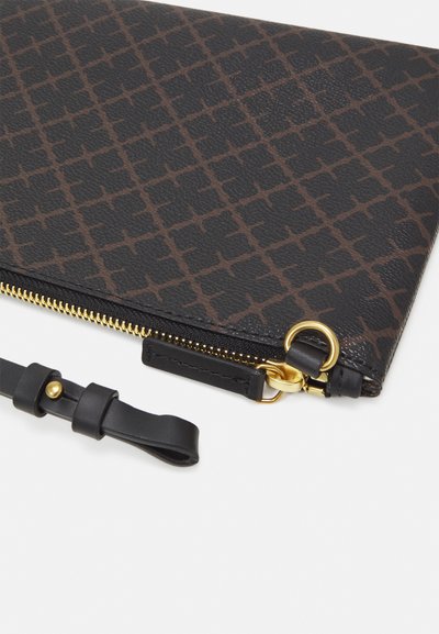 Black and brown patterned clutch, zippered top, gold hardware, textured leather, features a detachable black strap with a gold detail.