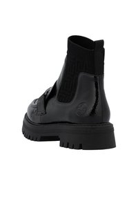 Rieker Bottines à plateau - schwarz